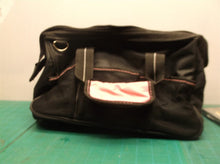 pink tool bag with assorted pink tools