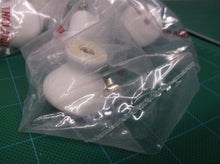 lot of 7 white cabinet knobs