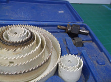 lot of 12 hole saws with 2 arbors