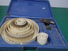 lot of 12 hole saws with 2 arbors