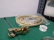 gold colored hand held shower hose set