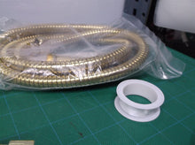 gold colored hand held shower hose set