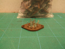 lot of assorted sized tube bases