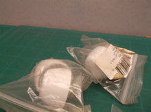 lot of tolet bolts with white caps