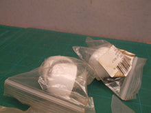 lot of tolet bolts with white caps