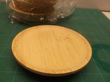 Lot of 4 wooden 4" saucers