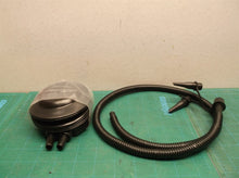 Hand pump for inflation or deflation with nozzle adapters