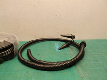 Hand pump for inflation or deflation with nozzle adapters