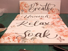 Set of 4 foam signs unwind soak relax breath