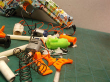 Assorted parts for the 2 GUARD Gel Snipers blasters