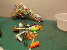 Assorted parts for the 2 GUARD Gel Snipers blasters