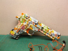 Assorted parts for the 2 GUARD Gel Snipers blasters