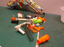 Assorted parts for the 2 GUARD Gel Snipers blasters
