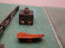 Assorted parts for a Drill Master 4 1/2" Angle Grinder #60625