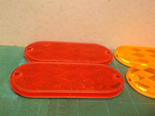 Lot of 4 oval 4.25" reflectors 2 amber 2 red