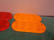 Lot of 4 oval 4.25" reflectors 2 amber 2 red