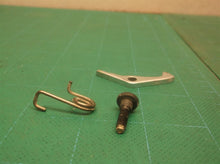 Gaurd lock assembly from a DeWALT DWE4011 4.5" Small Angle Grinder