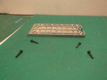 Rear plate with screws from a DEWALT D26676 PORTABLE HAND PLANER