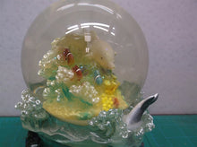 dolphin musical snow globe. Plays "Blue danube waltz"