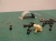 assorted parts off a Milwaukee 2475-20 M12 Compact Tire Inflator