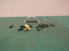 assorted parts off a Milwaukee 2475-20 M12 Compact Tire Inflator