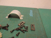 assorted parts off a Milwaukee 2475-20 M12 Compact Tire Inflator
