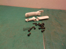 Assorted parts & hardware off a Ryobi 40V RY40204 string trimmer