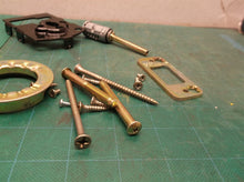Assorted parts off a Kwikset Aura Satin Nickel Electronic Bluetooth Keypad Smart