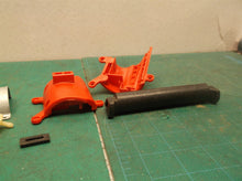 assorted parts off a Milwaukee 2475-20 M12 Compact Tire Inflator
