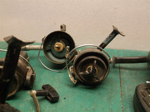 lot of 4 Mitchell reels with 1 hidden and 1 sport fisher for parts