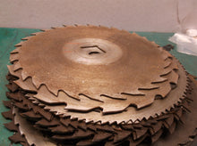 stack of 24 circular saw blades 10 in to 7 1/2 for crafts or misc.