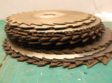 stack of 24 circular saw blades 10 in to 7 1/2 for crafts or misc.