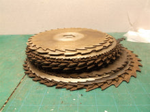 stack of 24 circular saw blades 10 in to 7 1/2 for crafts or misc.