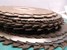 stack of 24 circular saw blades 10 in to 7 1/2 for crafts or misc.