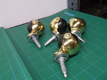lot of 4 gold open face casters