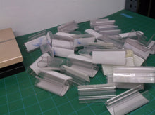 Lot of clear plastic shelf clips with hook & loop