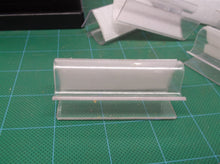 Lot of clear plastic shelf clips with hook & loop