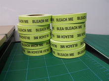 lot of 10 green rolls of tape saying "bleach me"