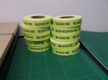 lot of 10 green rolls of tape saying "bleach me"
