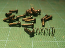 Assortment Of Screws Off Of a Ryobi P2108 18V Blower